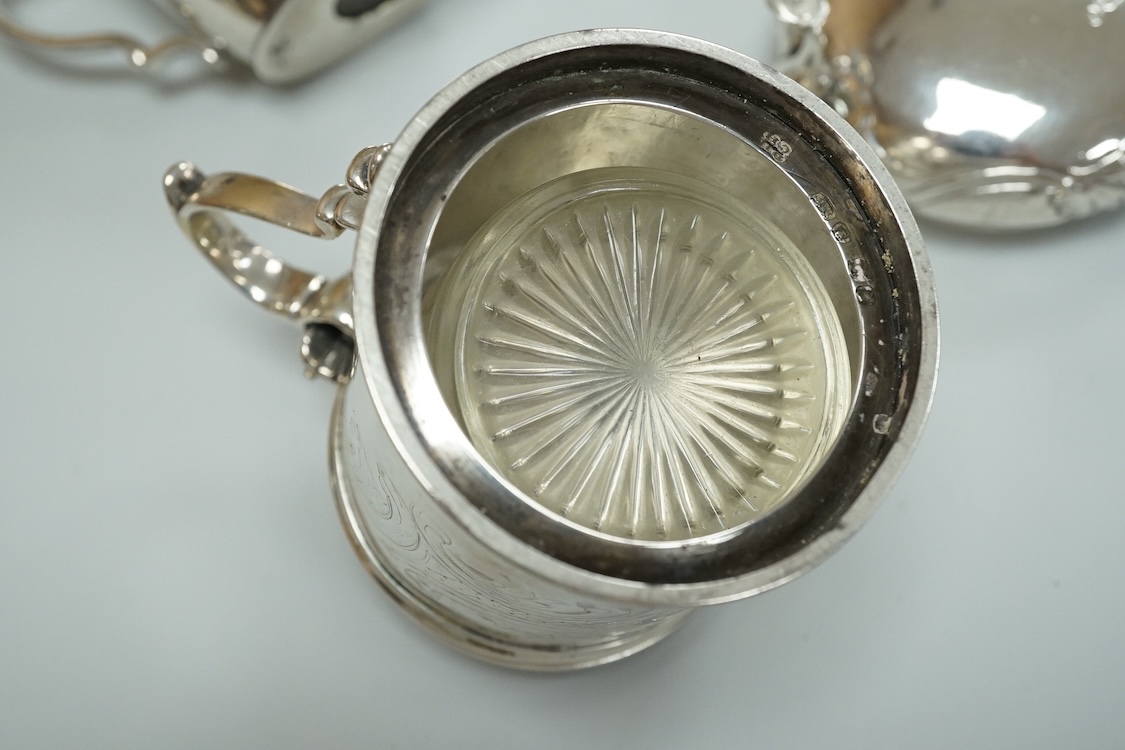 A Victorian silver drum mustard pot, a pair of later silver mustard pots and two silver salts including Victorian.